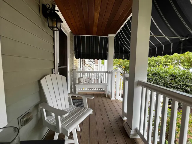 a view of balcony with wooden floor