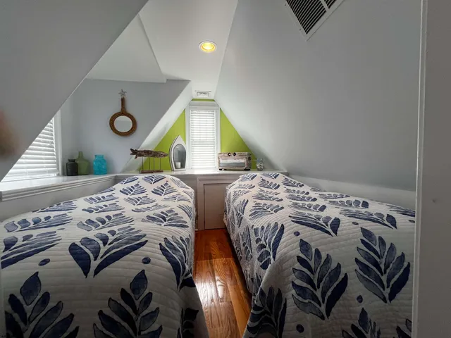 a bedroom with bed and a window