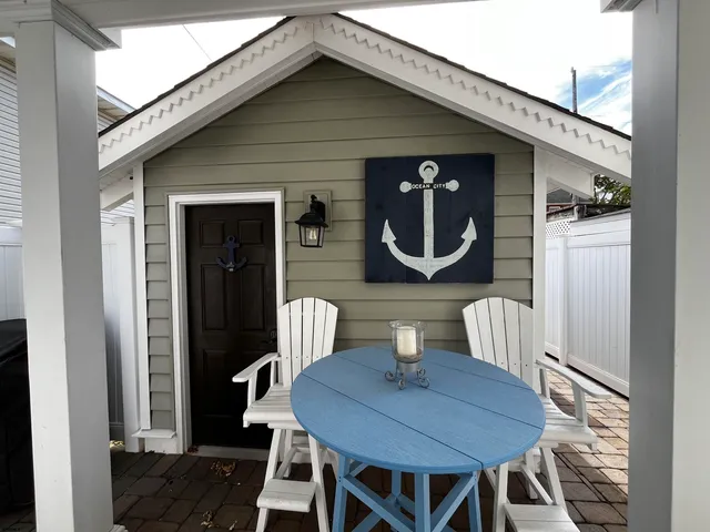 a dining room with furniture and a mirror