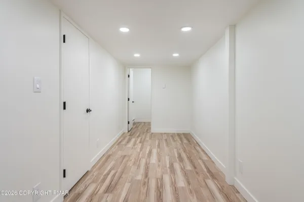 a view of wooden floor in an empty room