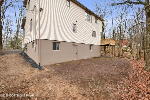 a view of a house with a yard and garage