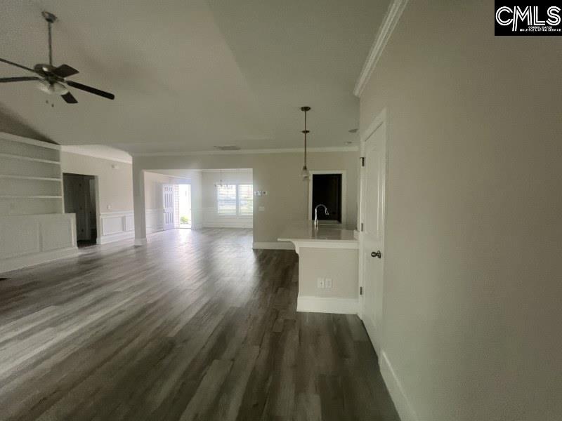 516 Mitscher Way Chapin, SC 29036 - Photo 4 of 18 a view of a hallway with wooden floor and a bathroom