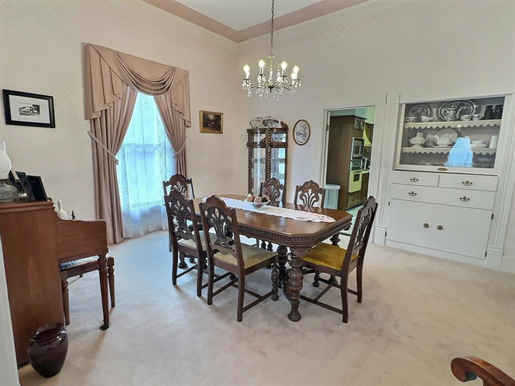 300 South Miller Street Rising Star, TX 76471 - Photo 11 of 39 a view of a dining room with furniture and chandelier