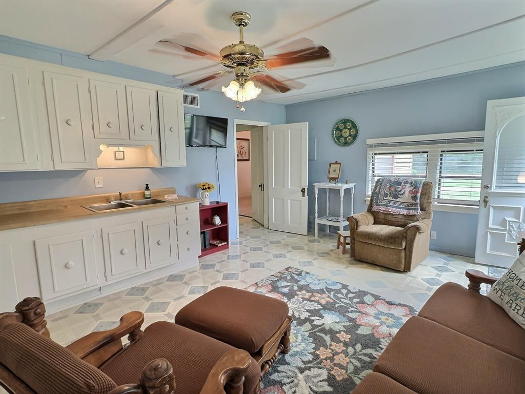 300 South Miller Street Rising Star, TX 76471 - Photo 25 of 39 a living room with furniture kitchen view and a window