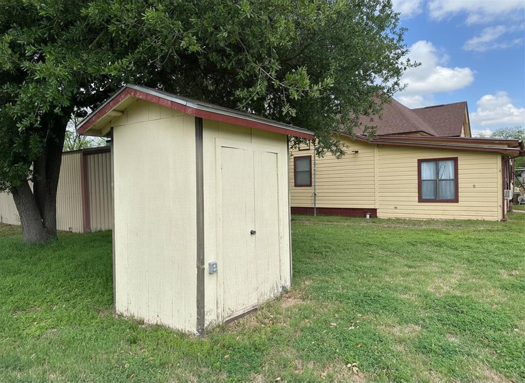 300 South Miller Street Rising Star, TX 76471 - Photo 3 of 39 a house with green field in front of it