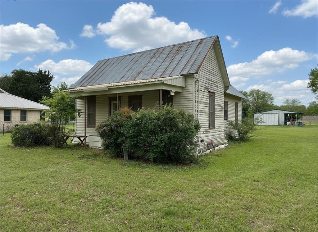 300 South Miller Street Rising Star, TX 76471 - Photo 32 of 39 a view of a house with a garden