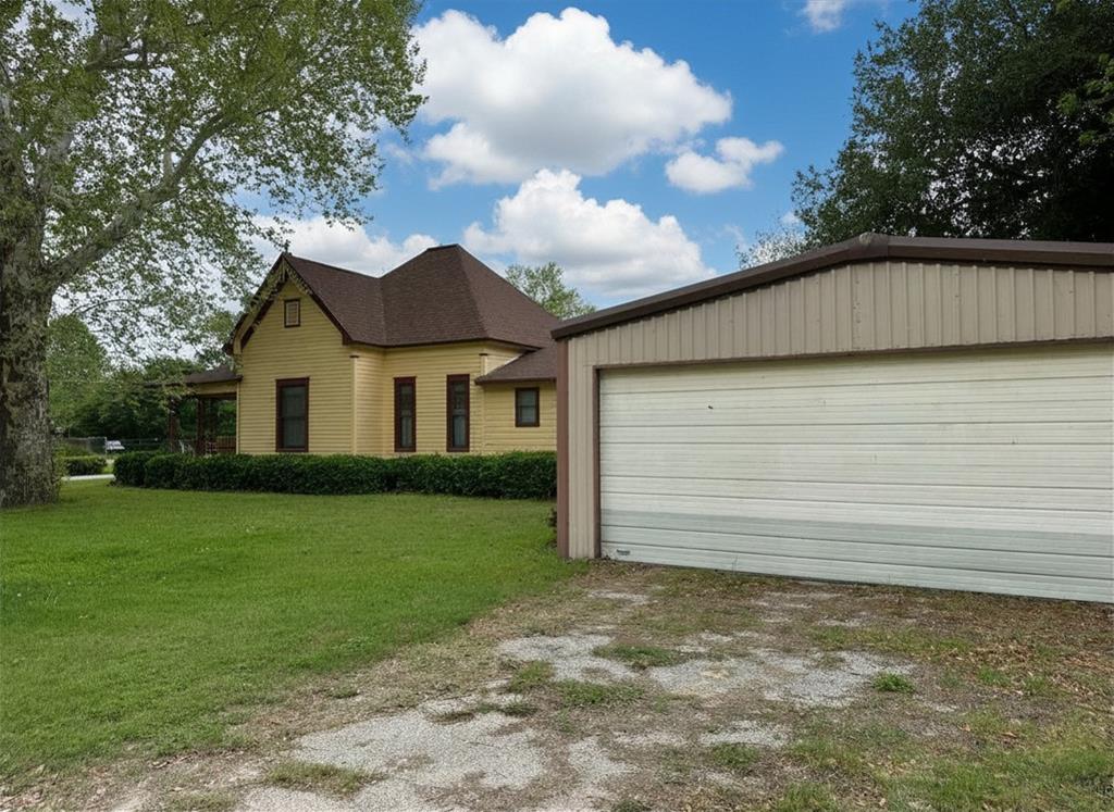 300 South Miller Street Rising Star, TX 76471 - Photo 4 of 39 a view of a house with a yard