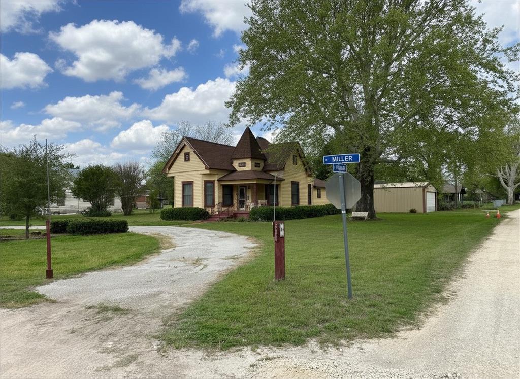 300 South Miller Street Rising Star, TX 76471 - Photo 6 of 39 a front view of a house with a garden and trees