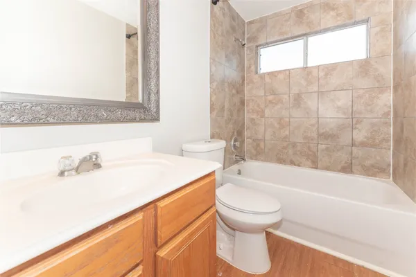 a bathroom with a sink a toilet and a bathtub