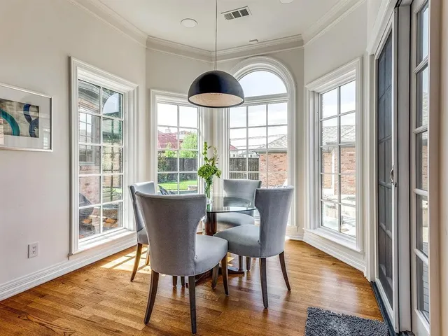 a dining room with furniture window wooden floor
