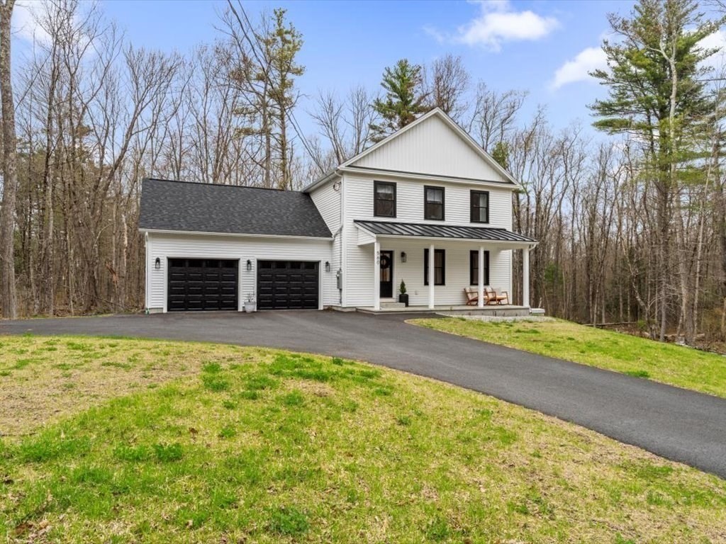 560 Queen Lake Road Phillipston, MA 01331 - Photo 1 of 42 a view of a house with pool and a yard