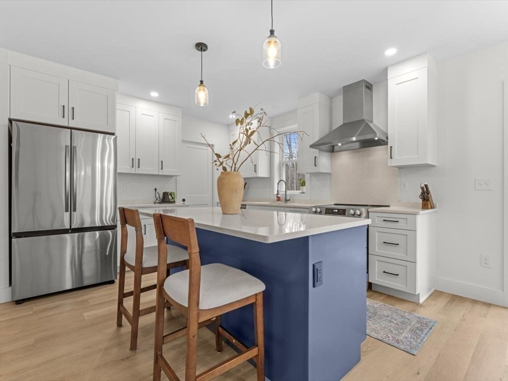 560 Queen Lake Road Phillipston, MA 01331 - Photo 12 of 42 a kitchen with stainless steel appliances granite countertop a sink a stove a refrigerator and a refrigerator