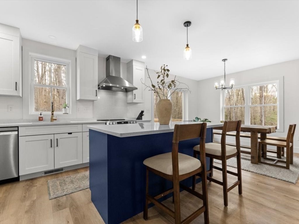 560 Queen Lake Road Phillipston, MA 01331 - Photo 13 of 42 a kitchen with sink dining table and chairs