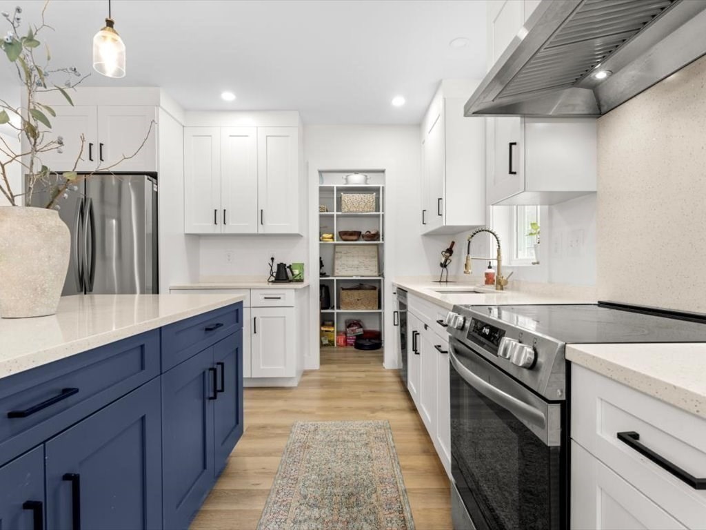 560 Queen Lake Road Phillipston, MA 01331 - Photo 16 of 42 a kitchen with stainless steel appliances a stove sink and cabinets