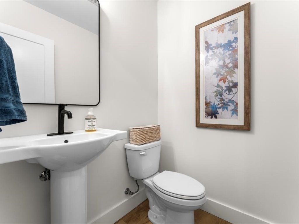 560 Queen Lake Road Phillipston, MA 01331 - Photo 19 of 42 a bathroom with a toilet sink and mirror
