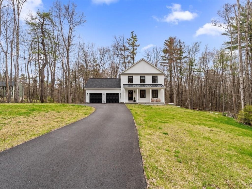 560 Queen Lake Road Phillipston, MA 01331 - Photo 2 of 42 a front view of a house with a yard