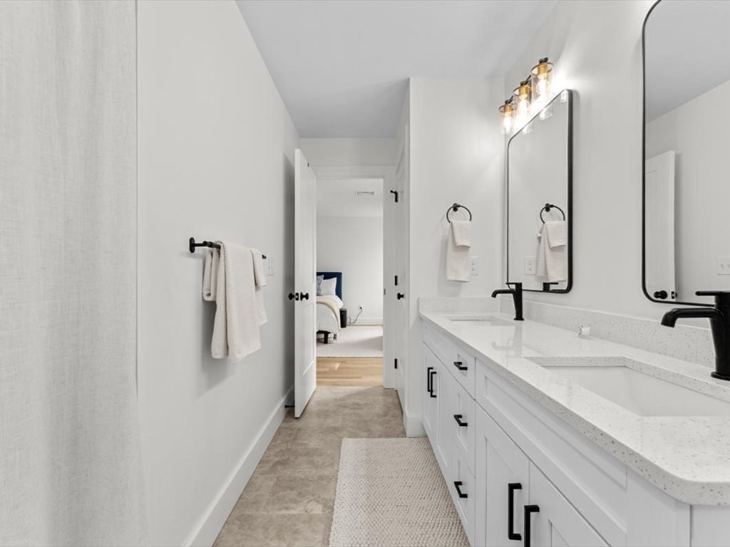 560 Queen Lake Road Phillipston, MA 01331 - Photo 23 of 42 a spacious bathroom with a double vanity sink mirror and shower