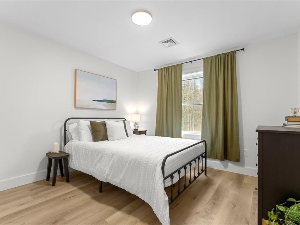 560 Queen Lake Road Phillipston, MA 01331 - Photo 24 of 42 a bedroom with a bed and a window