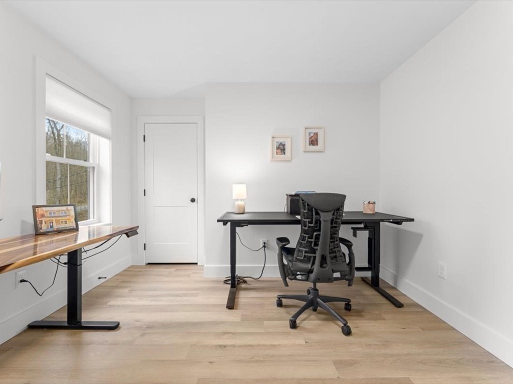 560 Queen Lake Road Phillipston, MA 01331 - Photo 26 of 42 a view of a workspace with furniture and a window