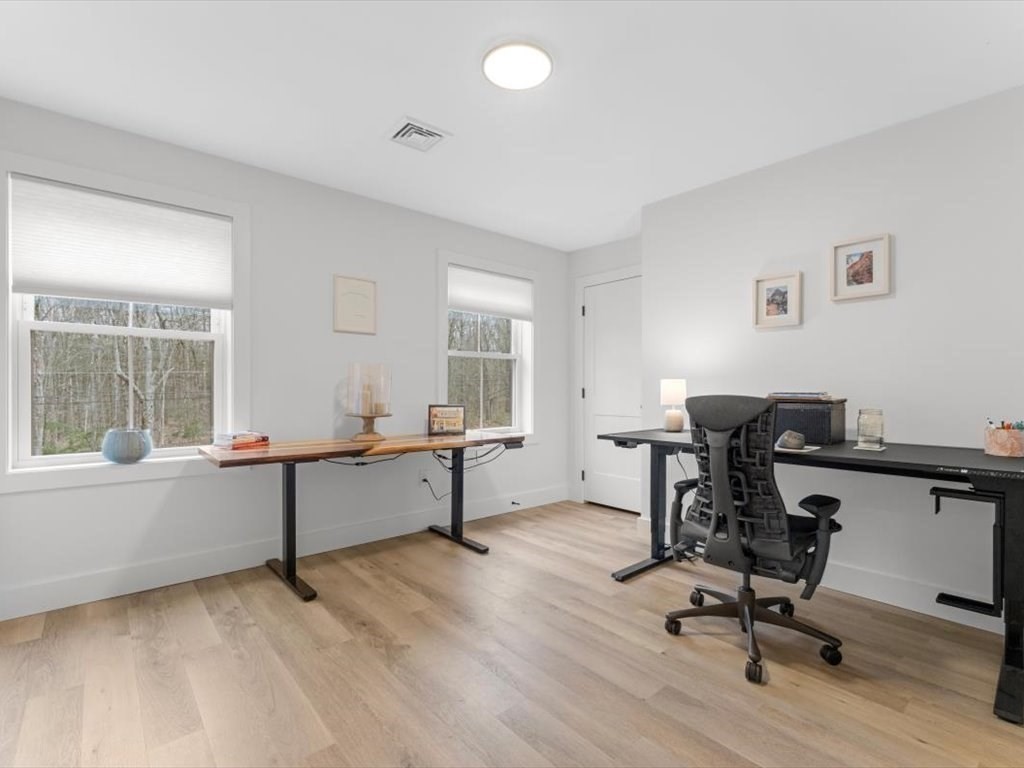 560 Queen Lake Road Phillipston, MA 01331 - Photo 27 of 42 a view of a workspace with furniture and a window
