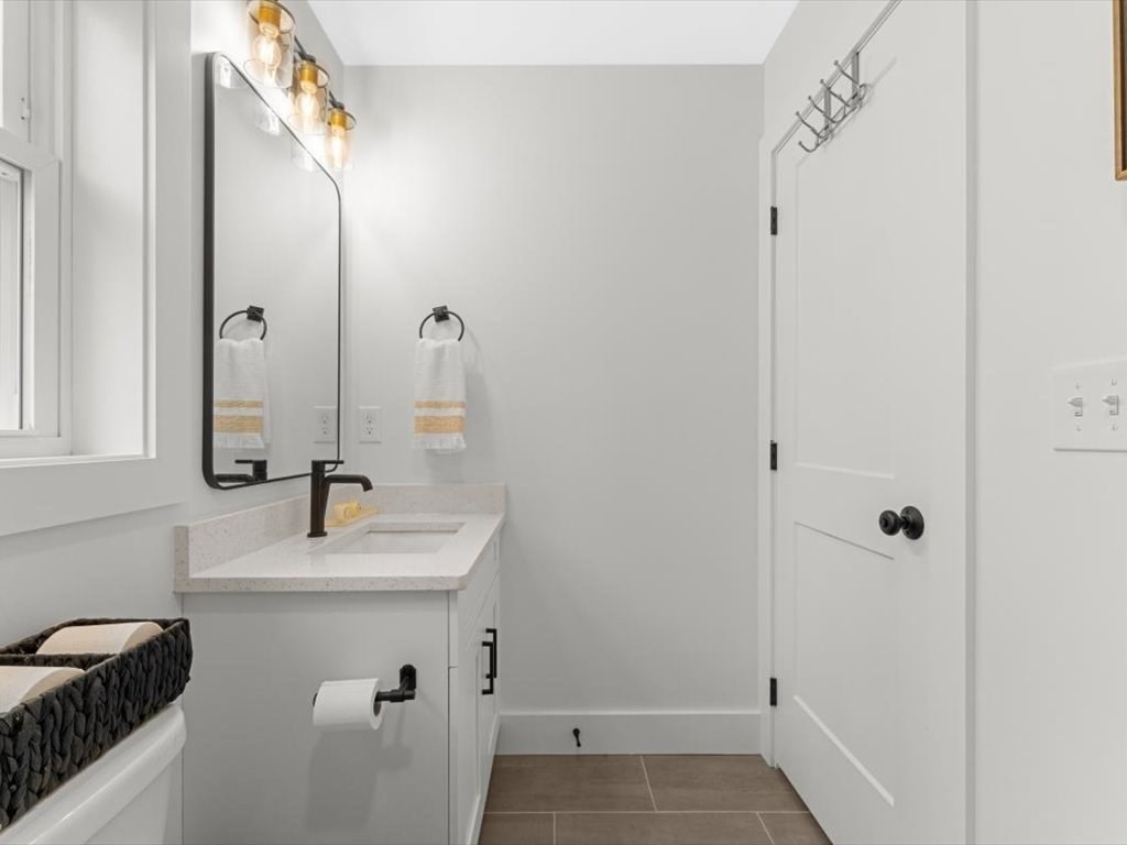560 Queen Lake Road Phillipston, MA 01331 - Photo 29 of 42 a bathroom with a sink and a mirror