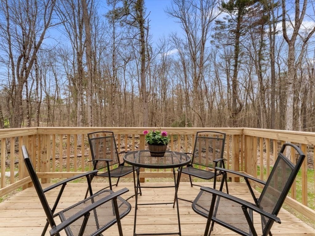 560 Queen Lake Road Phillipston, MA 01331 - Photo 33 of 42 a view of chairs and a table in the balcony