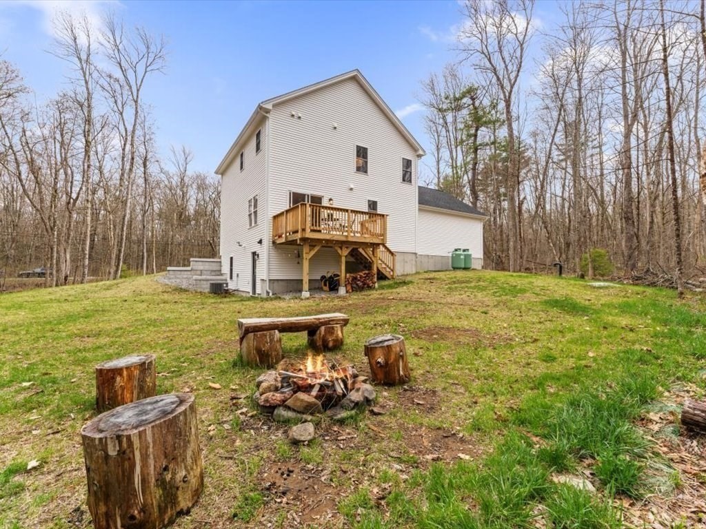 560 Queen Lake Road Phillipston, MA 01331 - Photo 35 of 42 a view of a house with backyard and sitting area