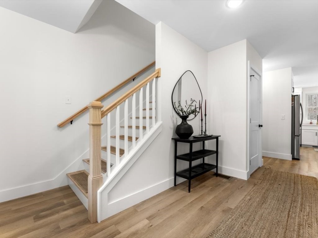 560 Queen Lake Road Phillipston, MA 01331 - Photo 5 of 42 a view of entryway with wooden floor and stairs