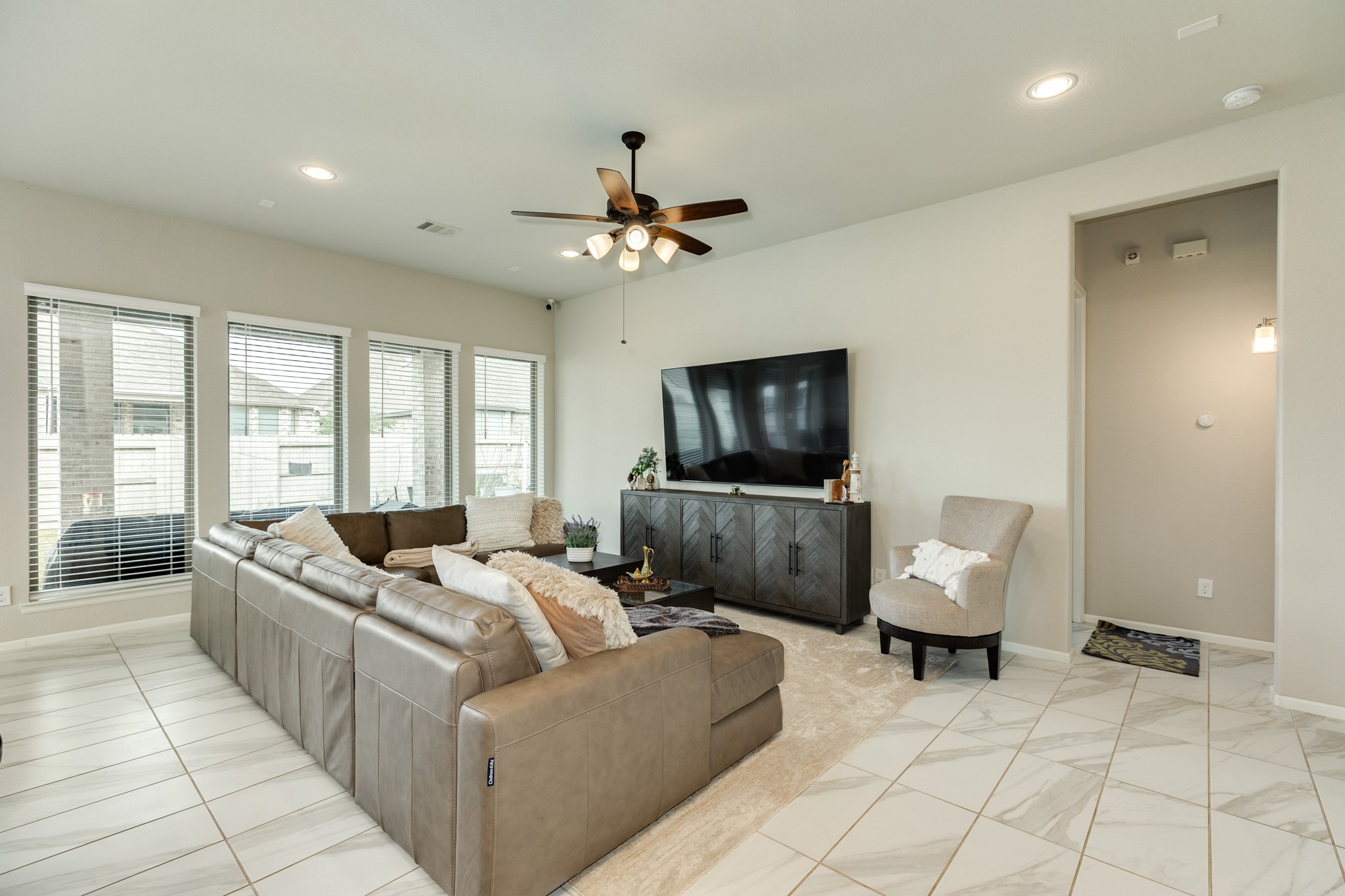 5138 Walnut Grv Lane Manvel, TX 77578 - Photo 8 of 43 a living room with furniture and a flat screen tv