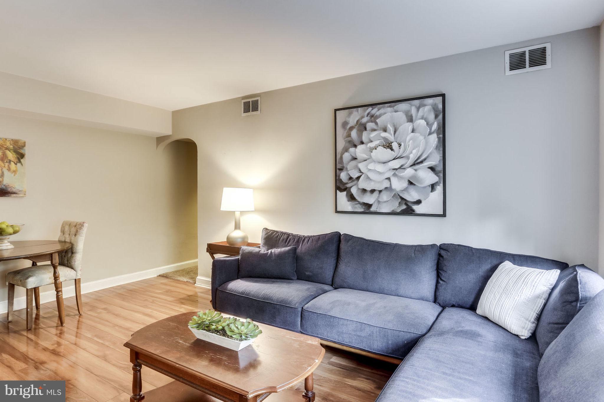 24 South Old Glebe Road, Unit 2C Arlington, VA 22204 - Photo 2 of 24 a living room with furniture and a wooden floor