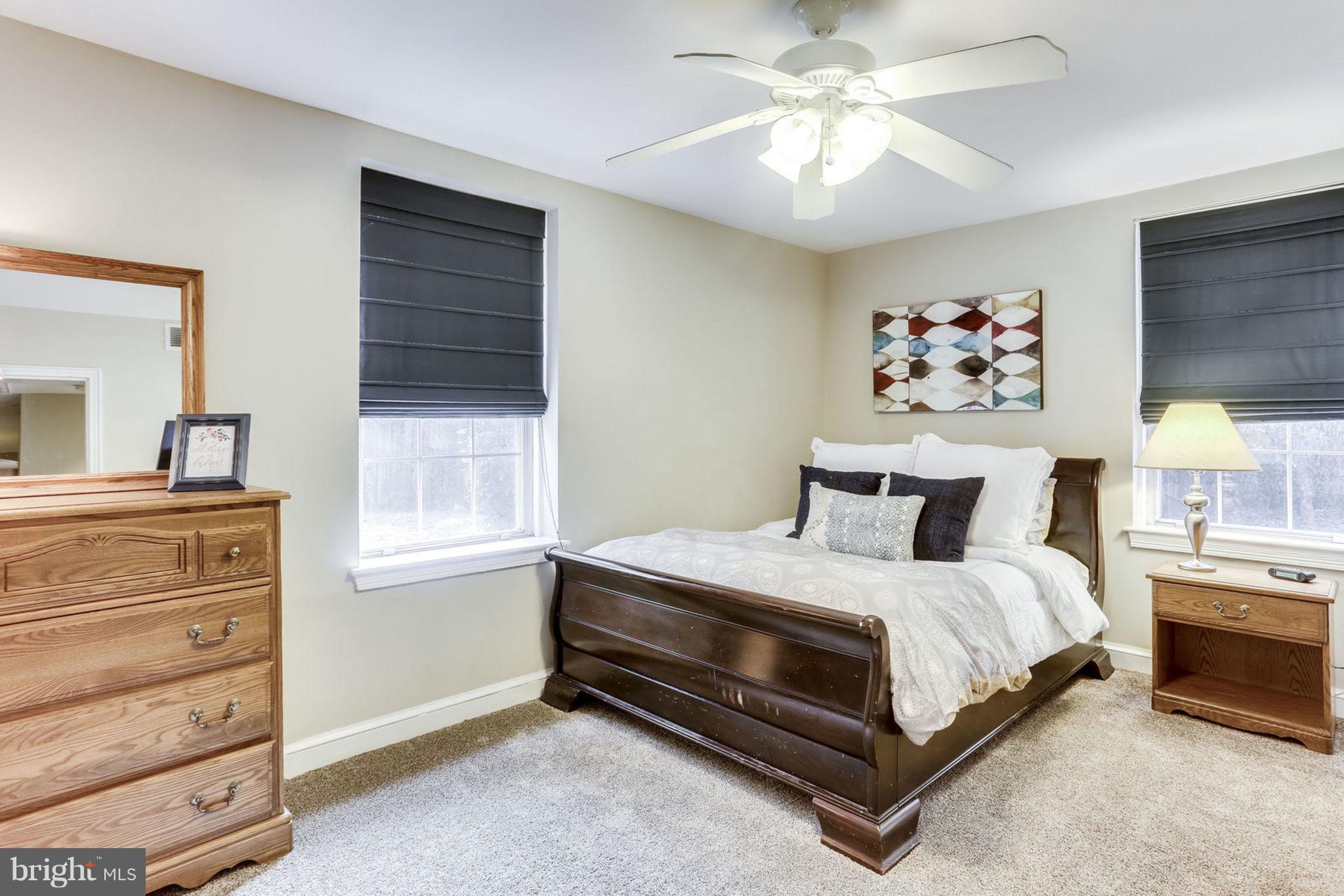 24 South Old Glebe Road, Unit 2C Arlington, VA 22204 - Photo 12 of 24 a bedroom with a bed and a dresser