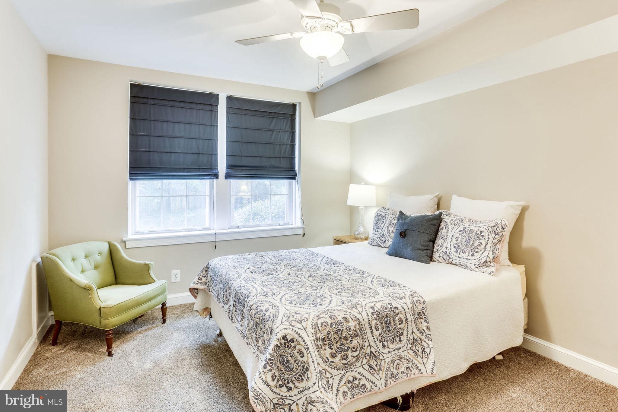 24 South Old Glebe Road, Unit 2C Arlington, VA 22204 - Photo 16 of 24 a bedroom with a bed and a couch