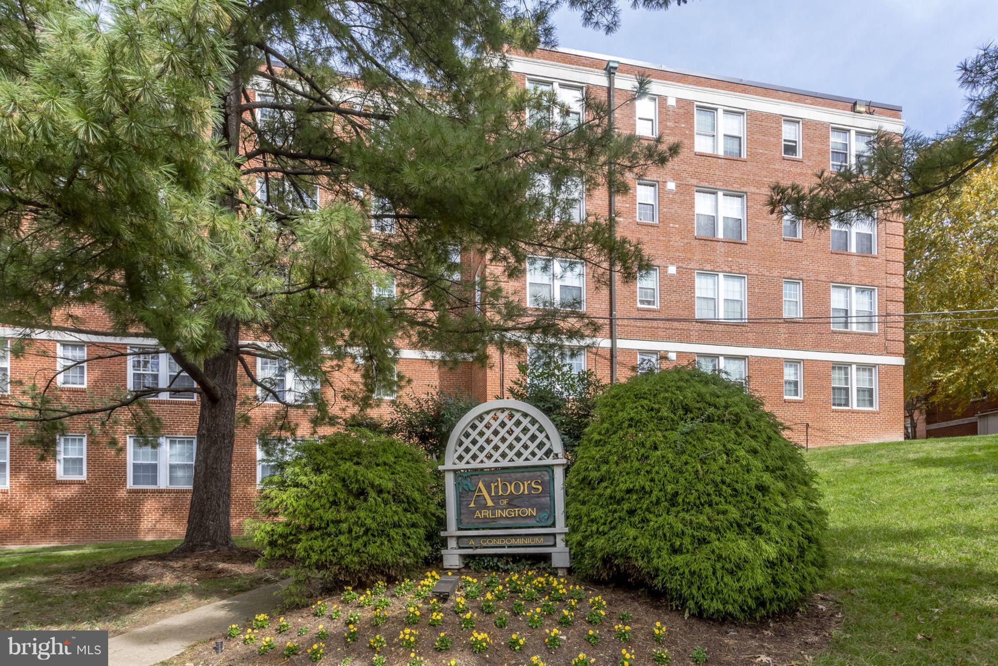 24 South Old Glebe Road, Unit 2C Arlington, VA 22204 - Photo 19 of 24 a view of a brick building next to a yard