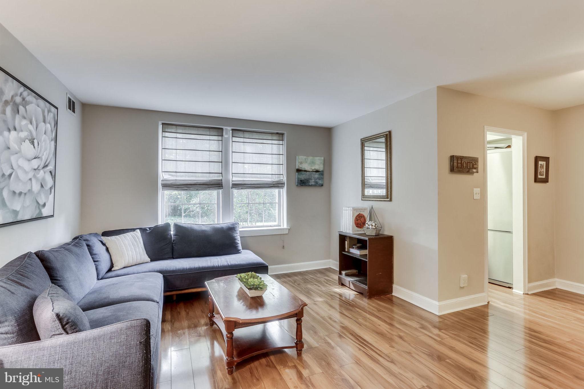 24 South Old Glebe Road, Unit 2C Arlington, VA 22204 - Photo 3 of 24 a living room with furniture and a wooden floor