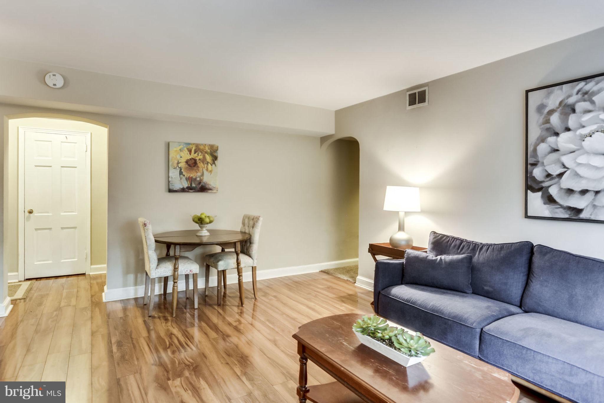 24 South Old Glebe Road, Unit 2C Arlington, VA 22204 - Photo 5 of 24 a living room with furniture and a wooden floor