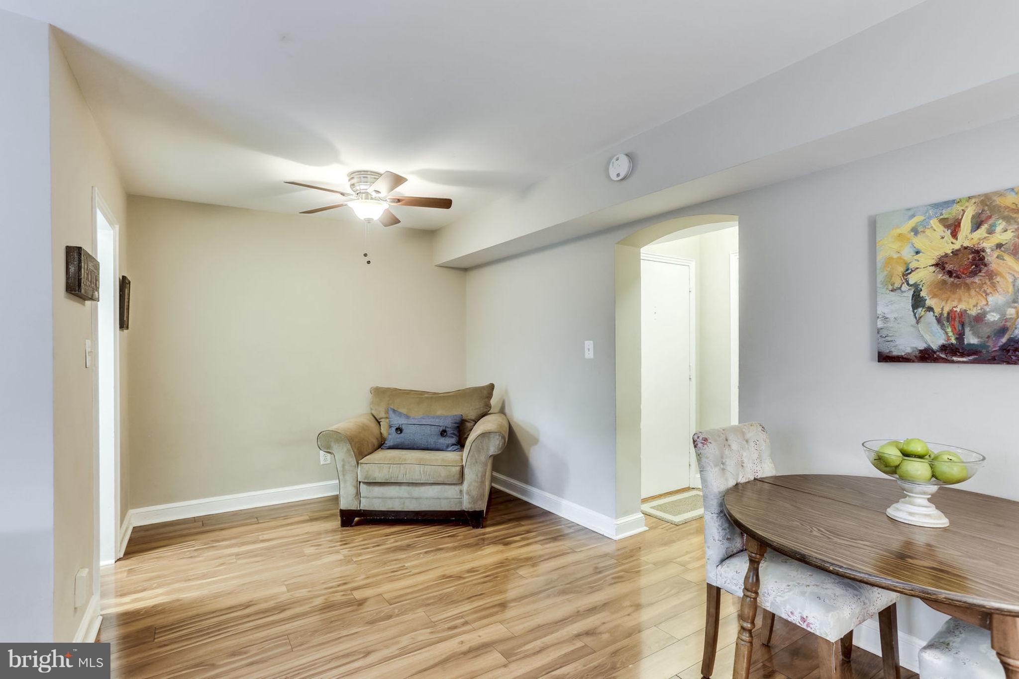 24 South Old Glebe Road, Unit 2C Arlington, VA 22204 - Photo 6 of 24 a view of a livingroom with furniture and a ceiling fan