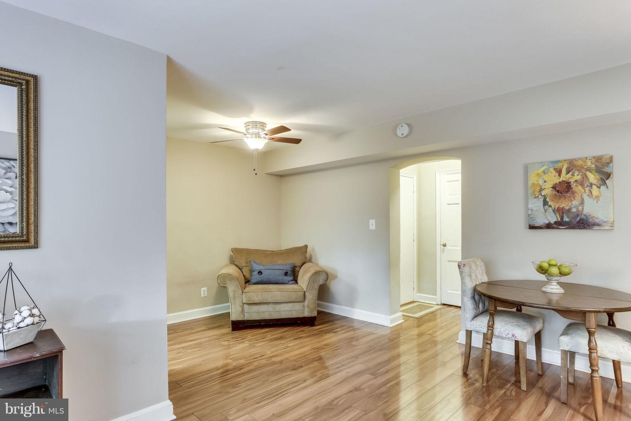 24 South Old Glebe Road, Unit 2C Arlington, VA 22204 - Photo 7 of 24 a view of a livingroom with furniture and wooden floor