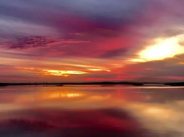 a view of a lake in middle of a town