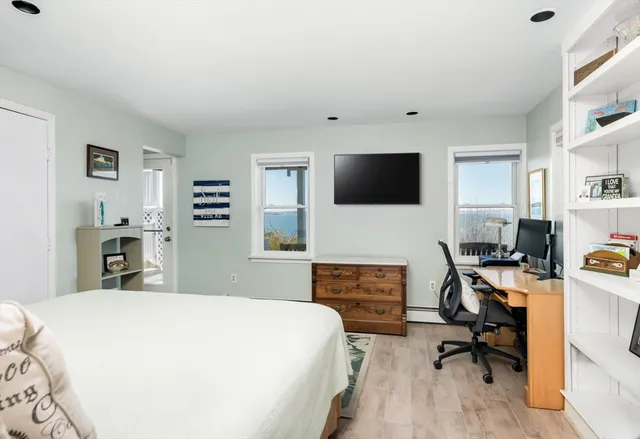 a bedroom with a workspace