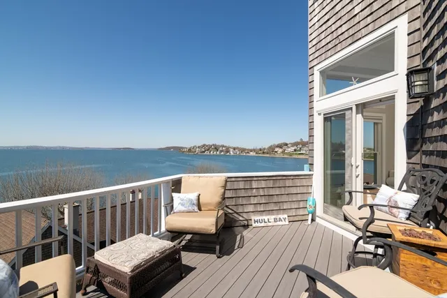 a view of a balcony with wooden floor