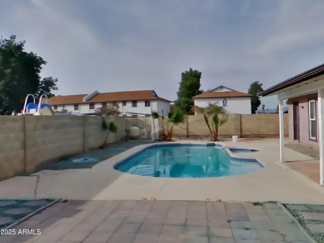 a view of outdoor space with swimming pool