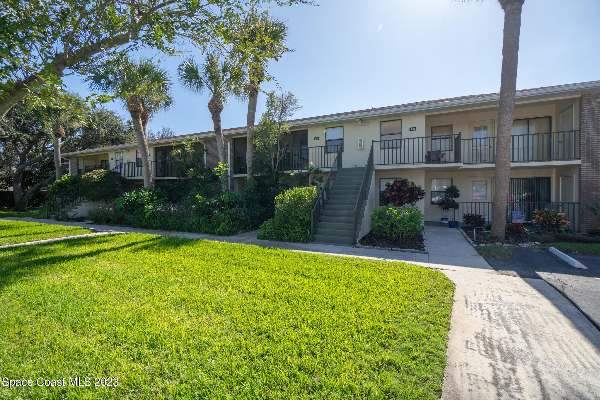 500 Catalina Road, Unit 103 Cocoa Beach, FL 32931 - Photo 25 of 28 a view of a house with swimming pool
