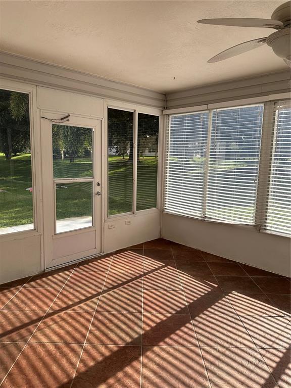 917 Camino Del Rey Drive Lady Lake, FL 32159 - Photo 23 of 46 a view of a room with wooden floor and a window