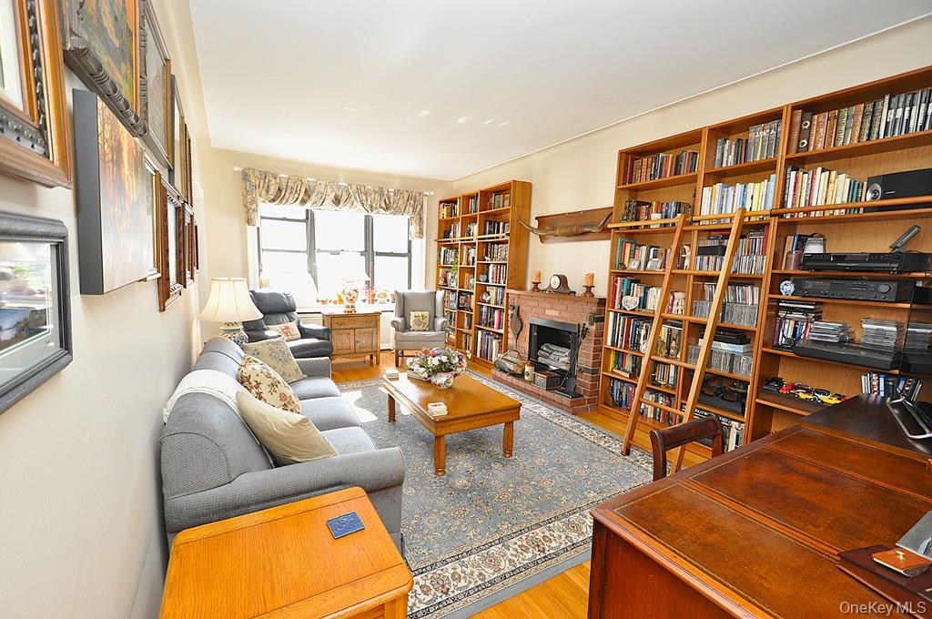 143 Garth Road, Unit 4D Scarsdale, NY 10583 - Photo 15 of 45 The large living room and dining area has sunny southern exposures, has hardwood floors and is approx 20'-1" x 12'-6".
