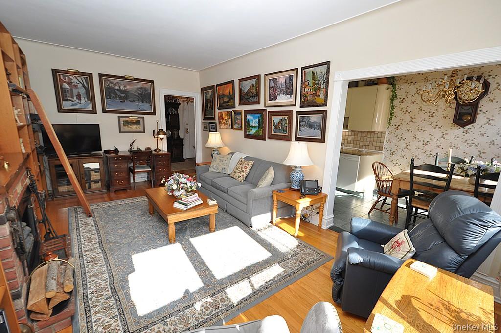 143 Garth Road, Unit 4D Scarsdale, NY 10583 - Photo 16 of 45 The large living room and dining area has sunny southern exposures, has hardwood floors and is approx 20'-1" x 12'-6".