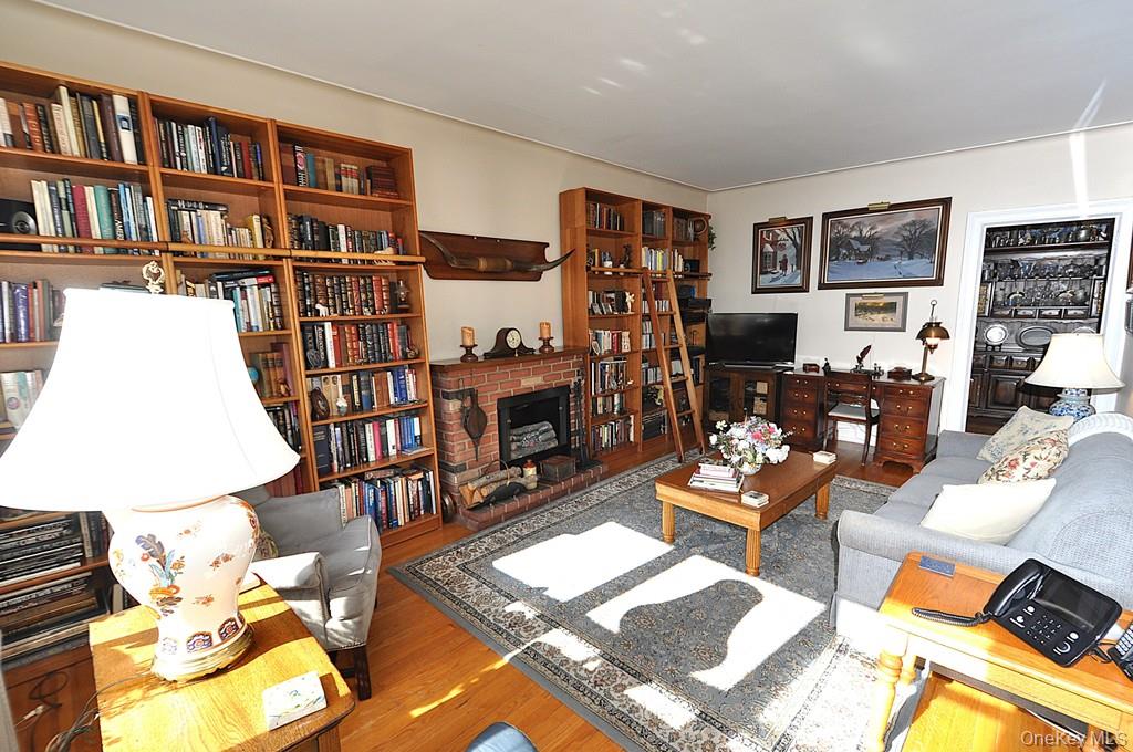 143 Garth Road, Unit 4D Scarsdale, NY 10583 - Photo 17 of 45 The large living room and dining area has sunny southern exposures, has hardwood floors and is approx 20'-1" x 12'-6".
