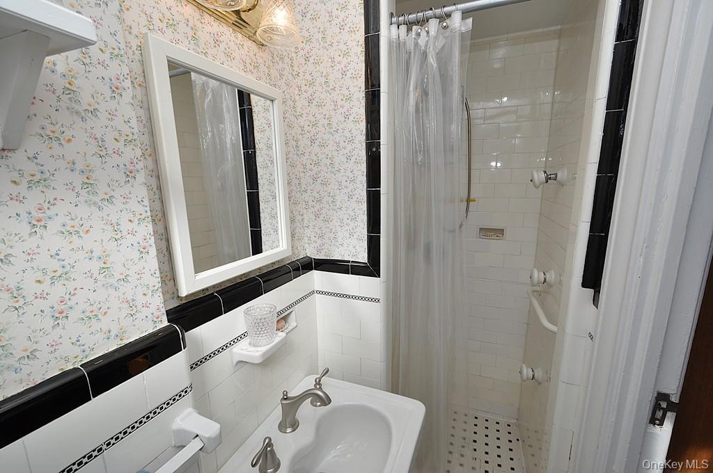 143 Garth Road, Unit 4D Scarsdale, NY 10583 - Photo 23 of 45 Primary private bedroom has a step in shower.