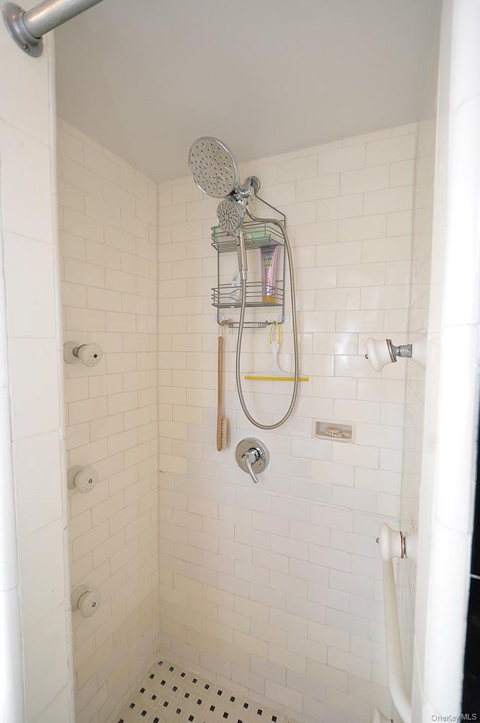 143 Garth Road, Unit 4D Scarsdale, NY 10583 - Photo 25 of 45 Primary private bedroom has a step in shower.
