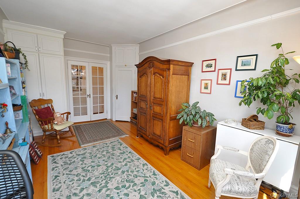 143 Garth Road, Unit 4D Scarsdale, NY 10583 - Photo 28 of 45 The large second bedroom has hardwood floors and overlooks tree lined Garth Road. The bedroom is approx 17'-1" x 10'-3".