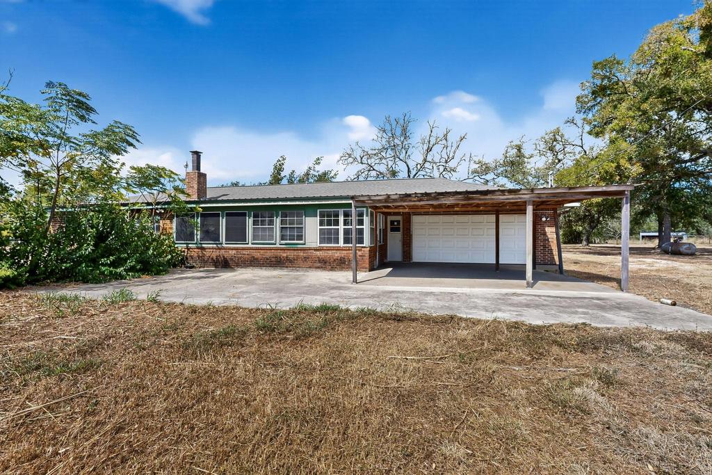 5180 Farm To Market Road 972 Granger, TX 76530 - Photo 34 of 39 front view of a house with a yard
